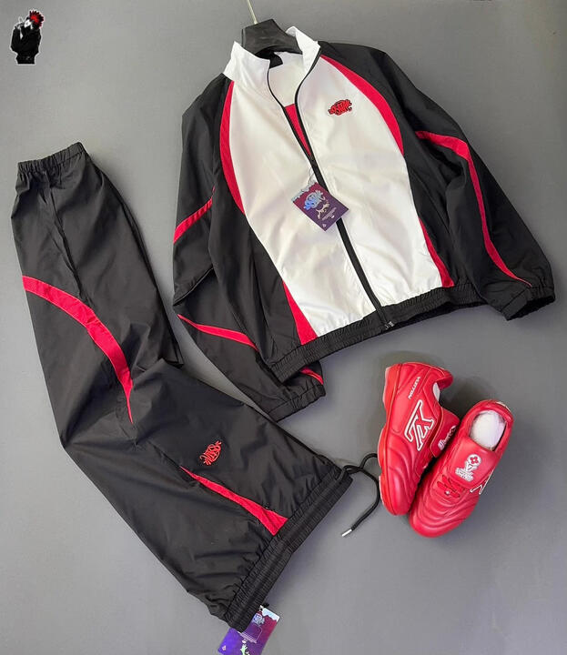Lightweight windbreaker jacket and matching pants with bold contrast panels. Designed for comfort, movement, and everyday street-luxury wear.